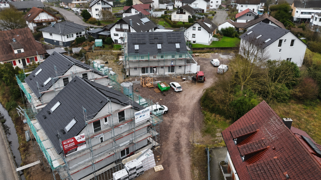 Residential area under construction with houses in various stages of completion